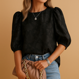 Elegant women’s floral blouse top with a flattering fit, ideal for both casual days and formal occasions in soft stylish colors.