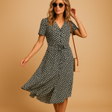 Floral midi dress for women named Lydia, with short sleeves and a flattering fit, perfect for summer parties, casual outings, and terrace days.