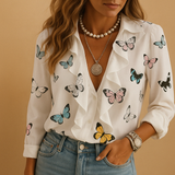 Women’s blouse with ruffles and butterfly print, long sleeves and a comfortable fit, ideal for spring to autumn wear.