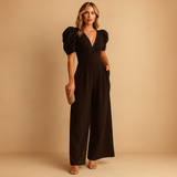 Long elegant jumpsuit for women with tailored waist and flowing design, perfect for formal dinners, galas, or special occasions.