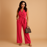 Elegant wrap jumpsuit for women with wide-leg trousers and tailored waist, perfect for formal occasions and stylish business events.