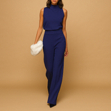Elegant women’s halter jumpsuit with wide legs, decorative bow, and pockets, ideal for parties, dinners, and warm-weather occasions.