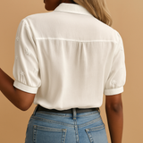 White button blouse for women with a classic collar, lightly tailored fit, and breathable fabric for both work and casual wear.